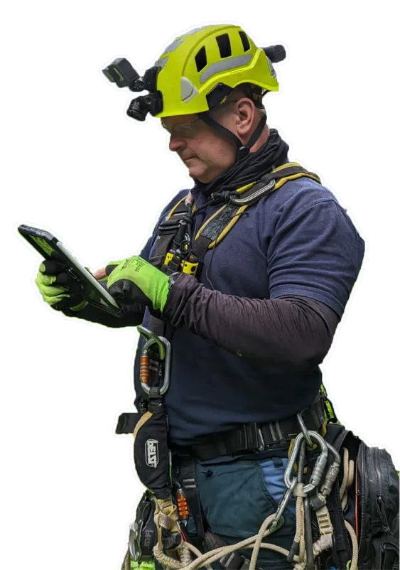 Paul Capper inspecting with a tablet