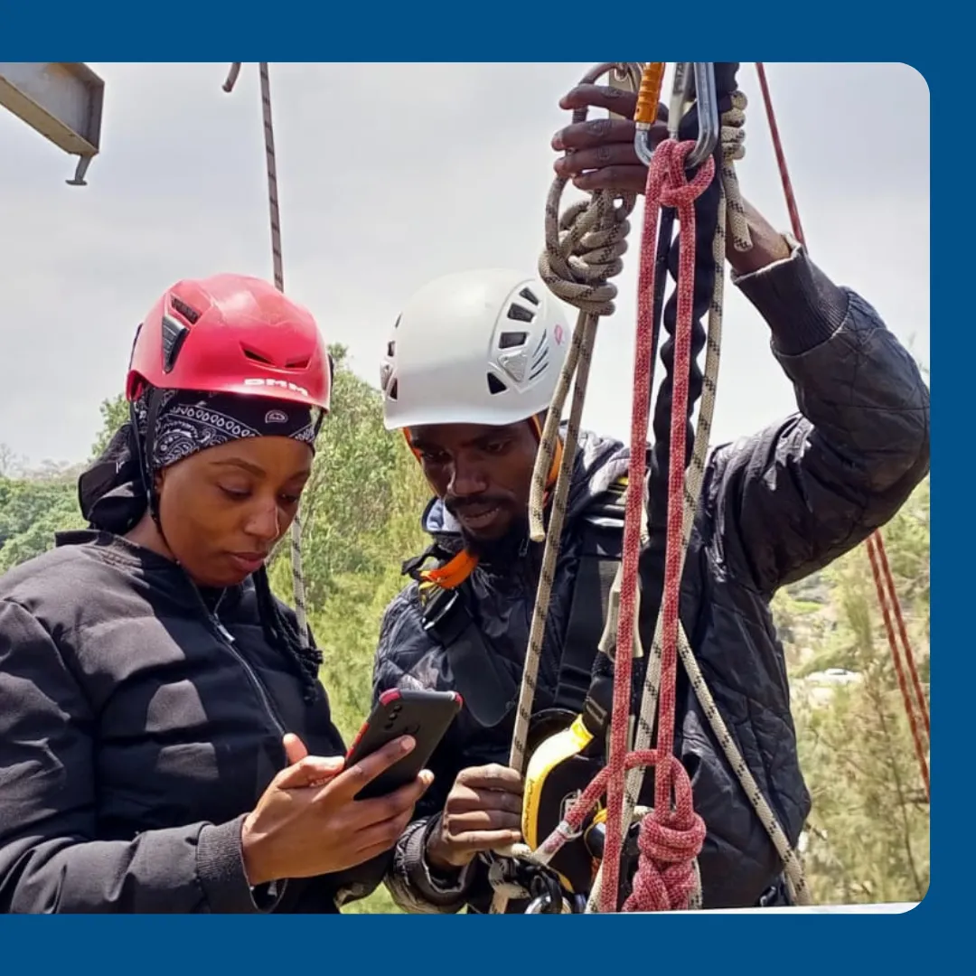 Instructors reviewing a staff assessment in the field